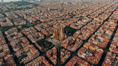 Aerial view of Barcelona's Eixample grid with the Sagrada Familia at its centre