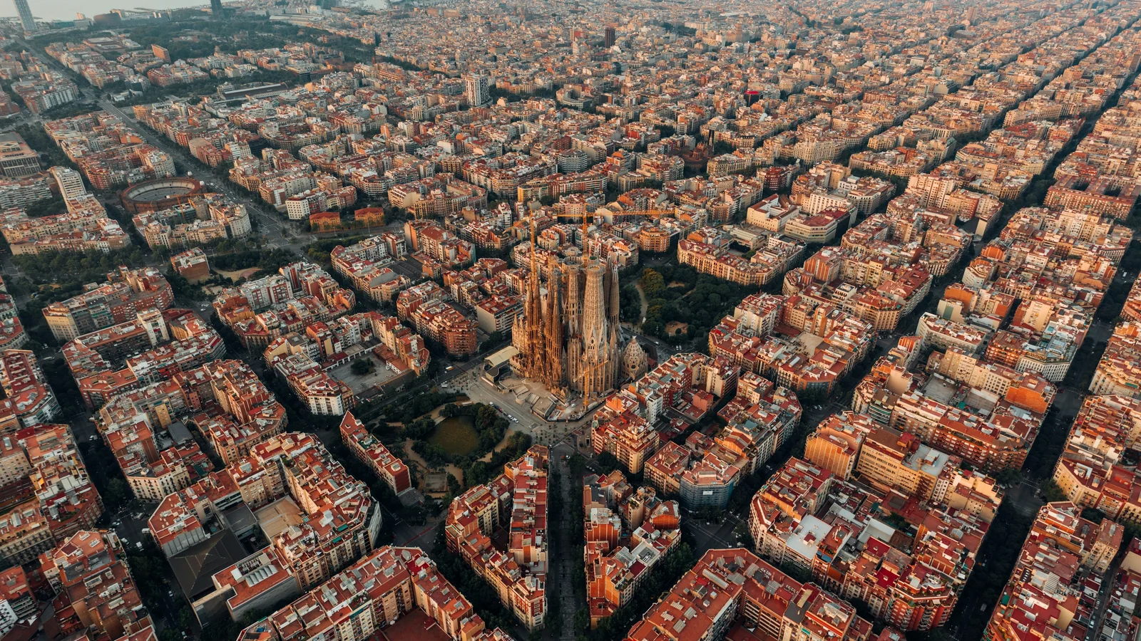 Aerial view of Barcelona's Eixample grid with the Sagrada Familia at its centre