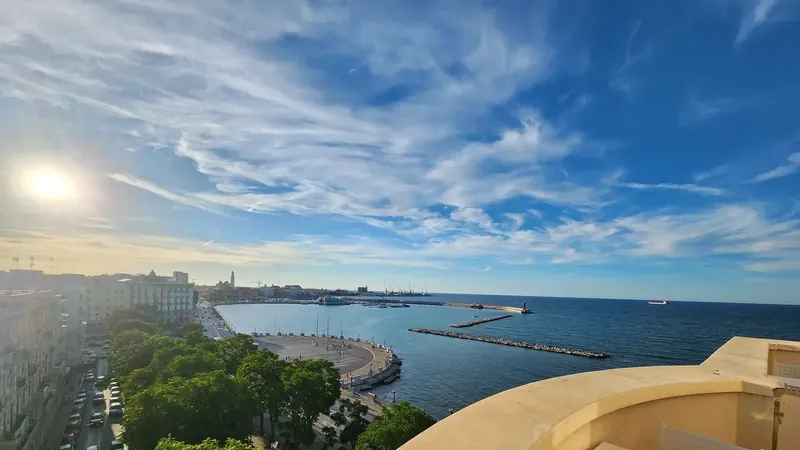 The Bari seafront and harbour seen from a balcony in evening light