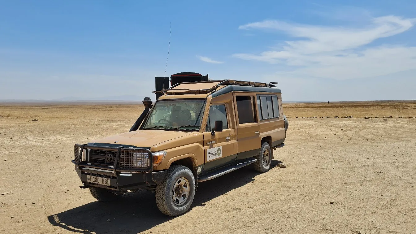 Our safari vehicle at the Serengeti National Park entrance gate